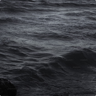 Dark ocean waves with textured ripples, natural water surface, moody atmosphere